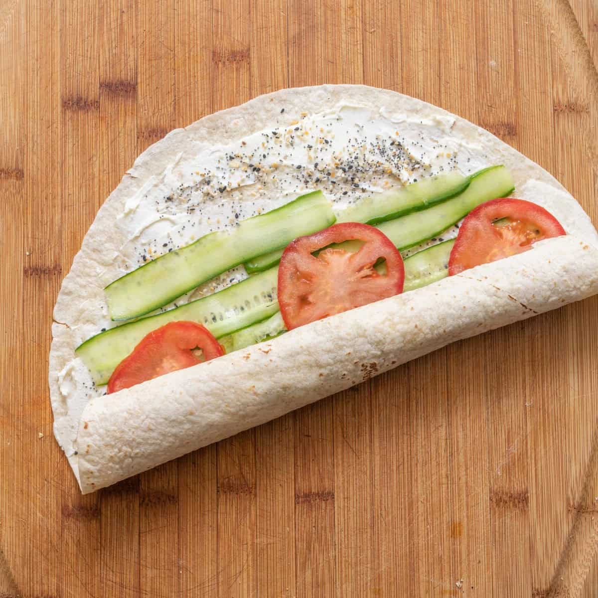 Tortilla rolled up half way.