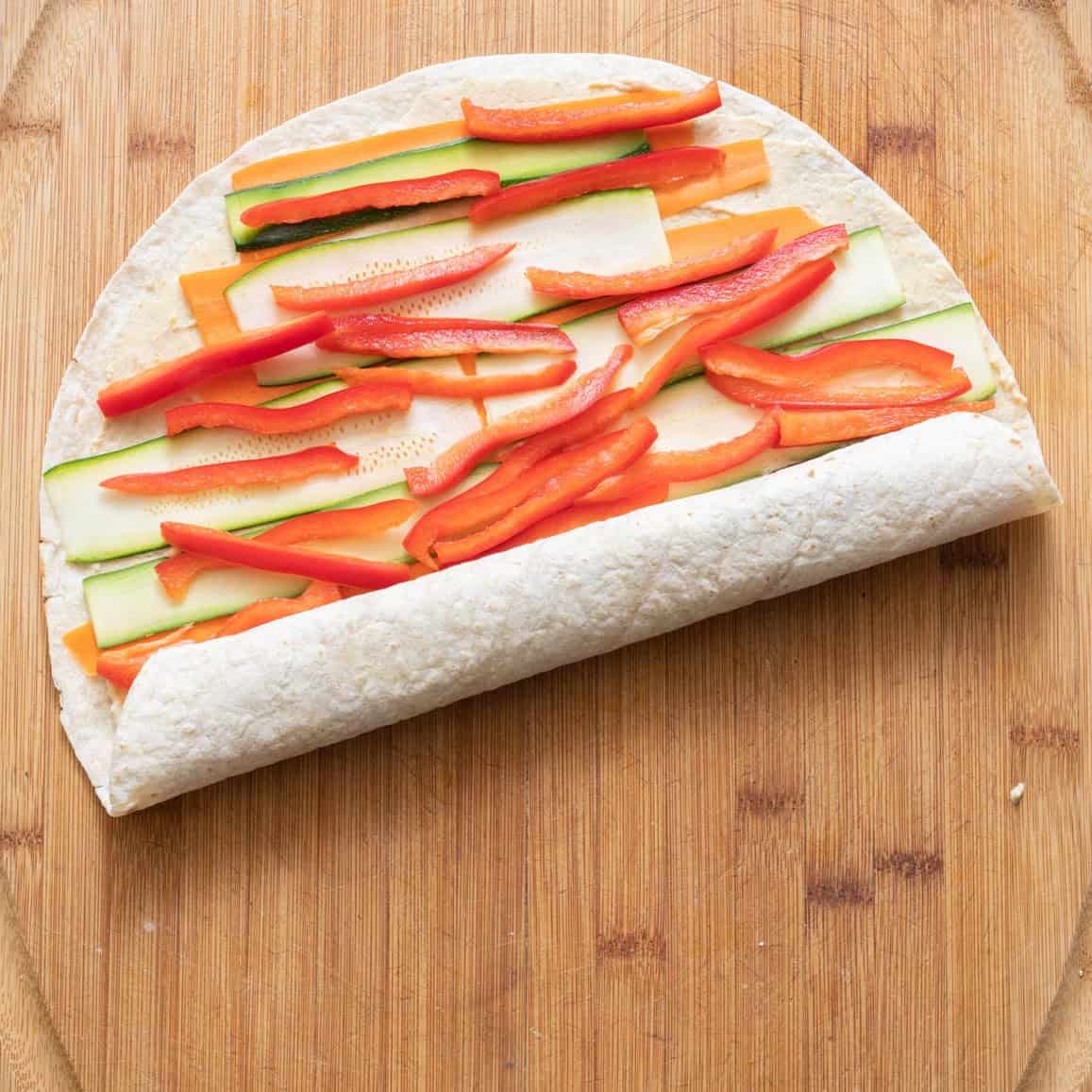 Tortilla rolled up half way.