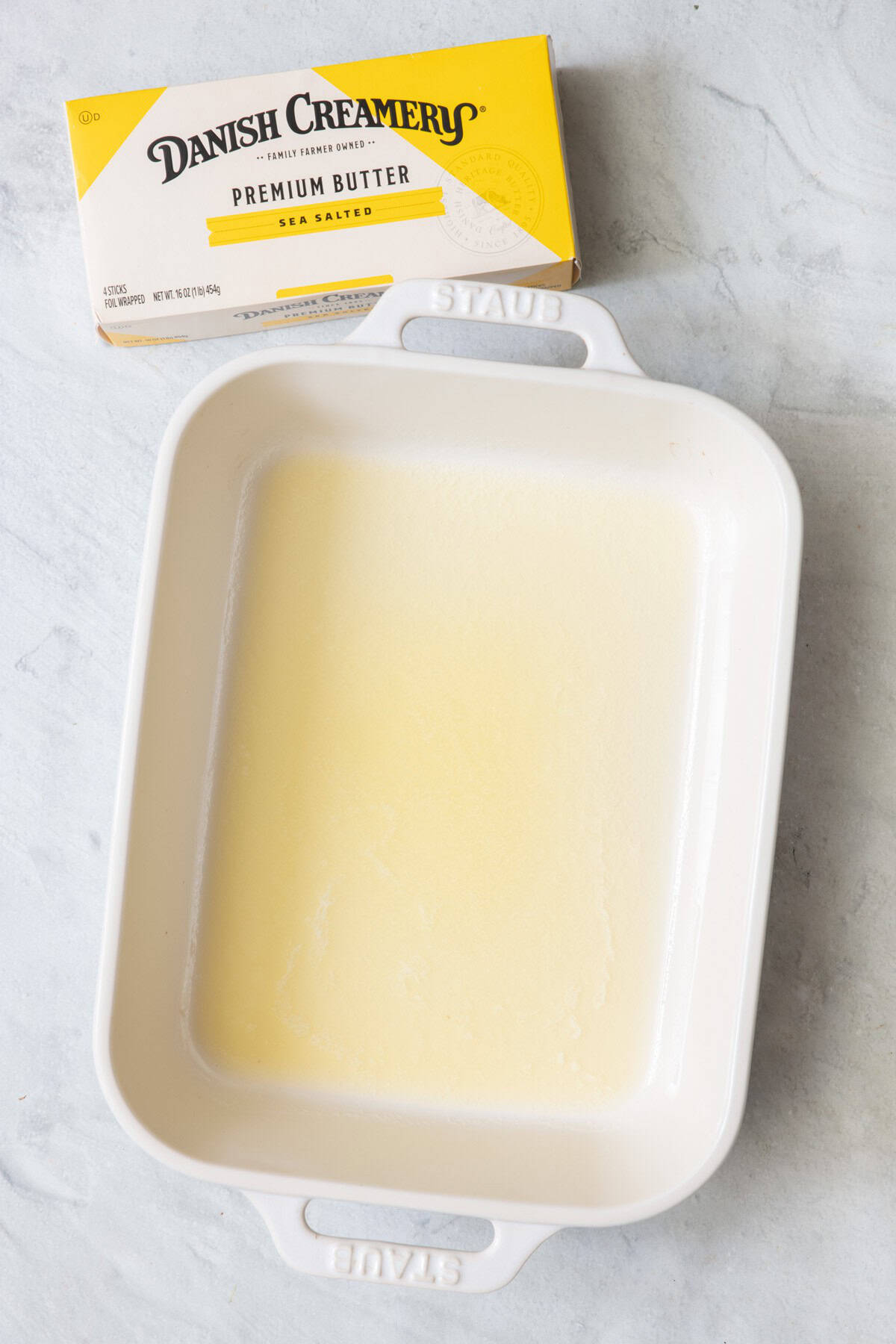 Melted butter in a baking dish,