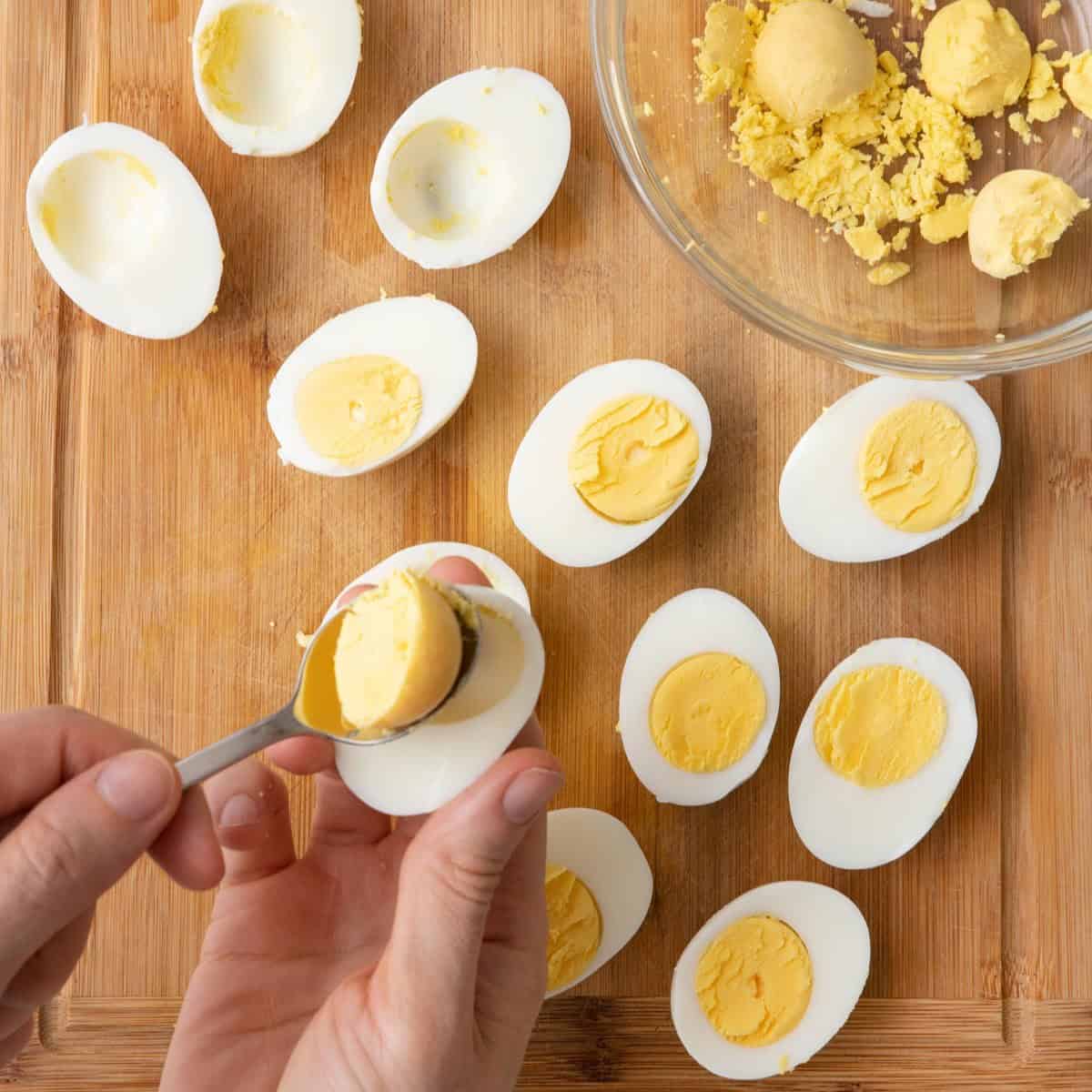 Scoop egg yolk out.