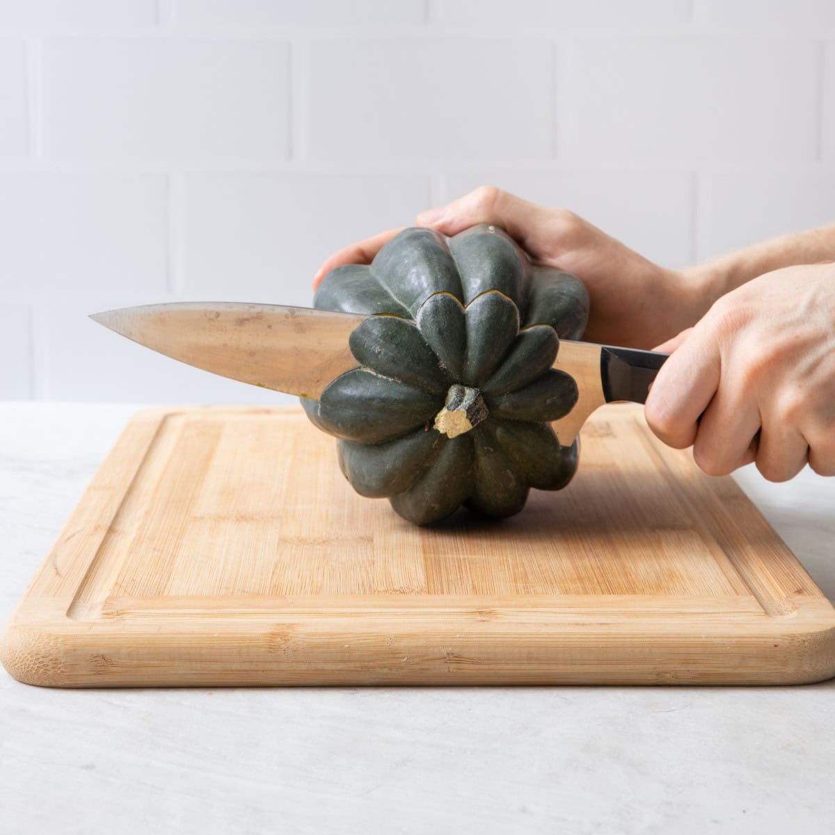Sharp knife cutting stem off.