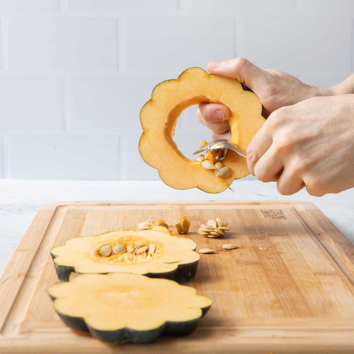 Scooping out seeds from one ring.