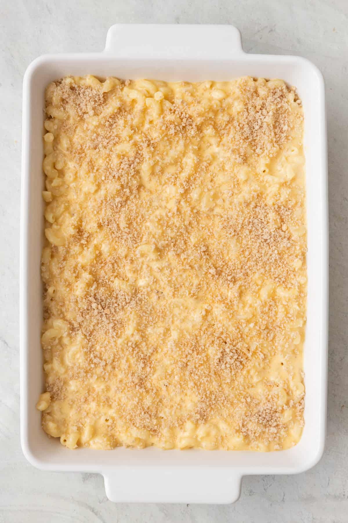 Mac and cheese in 8x11 baking dish with panko on top before baking.