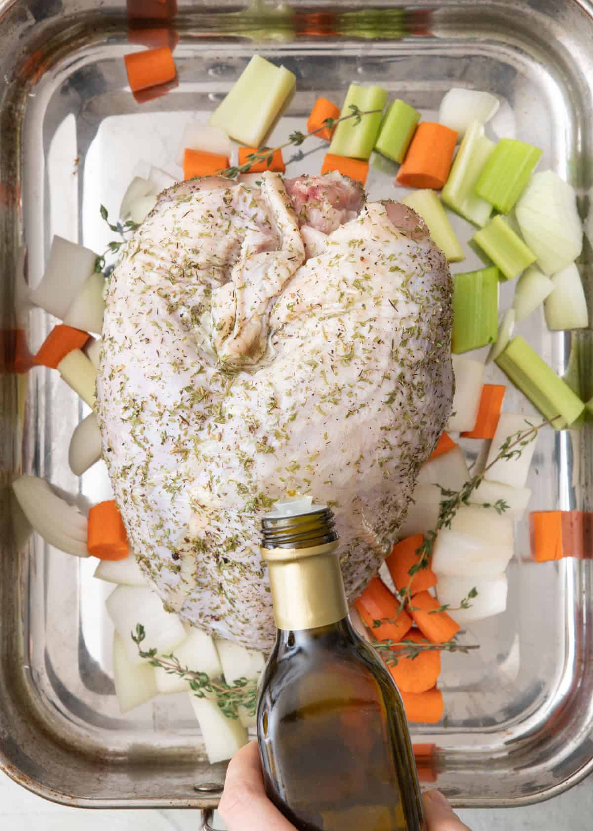 Turkey before cooked, with oil being spread on.