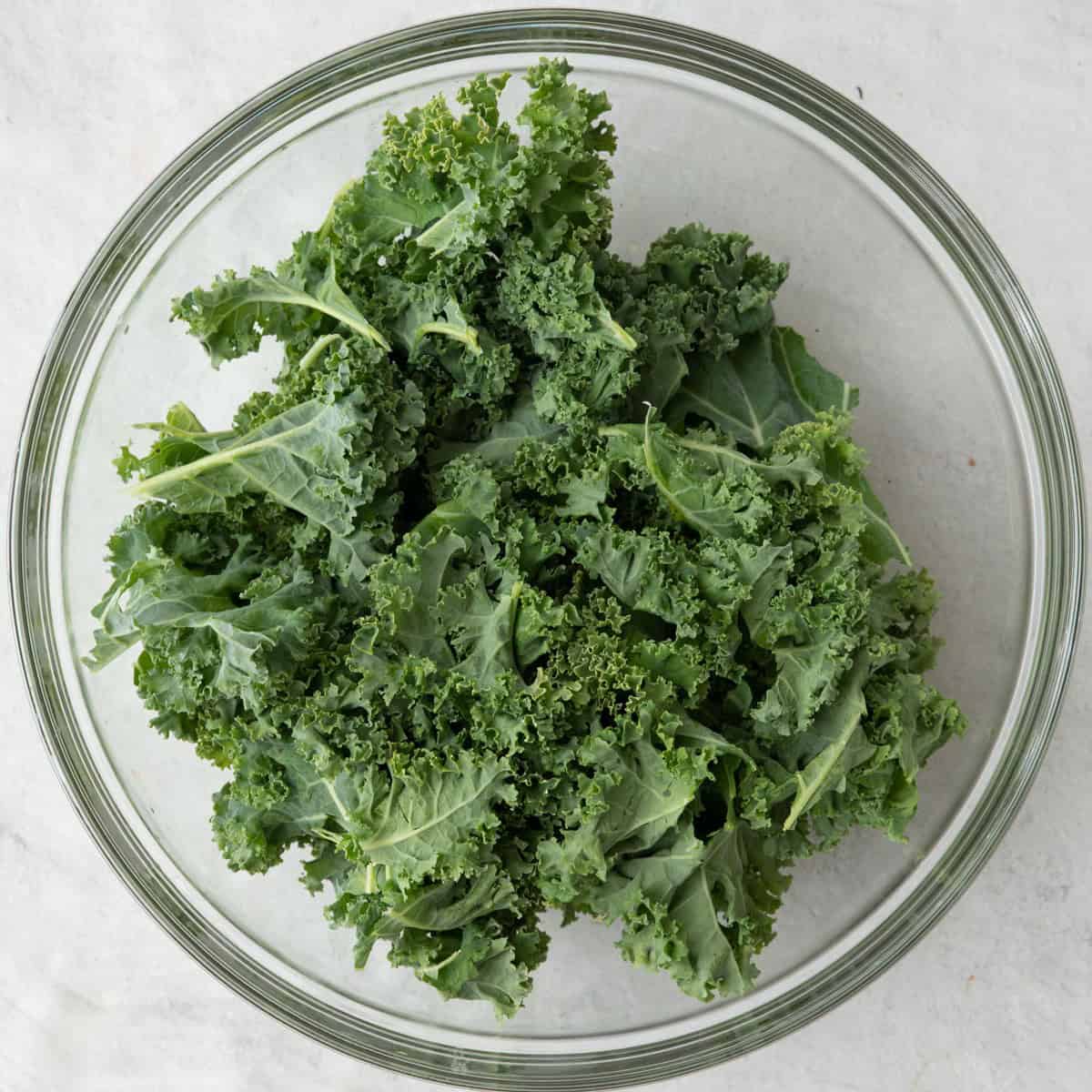 Chopped kale added on top of dressing.