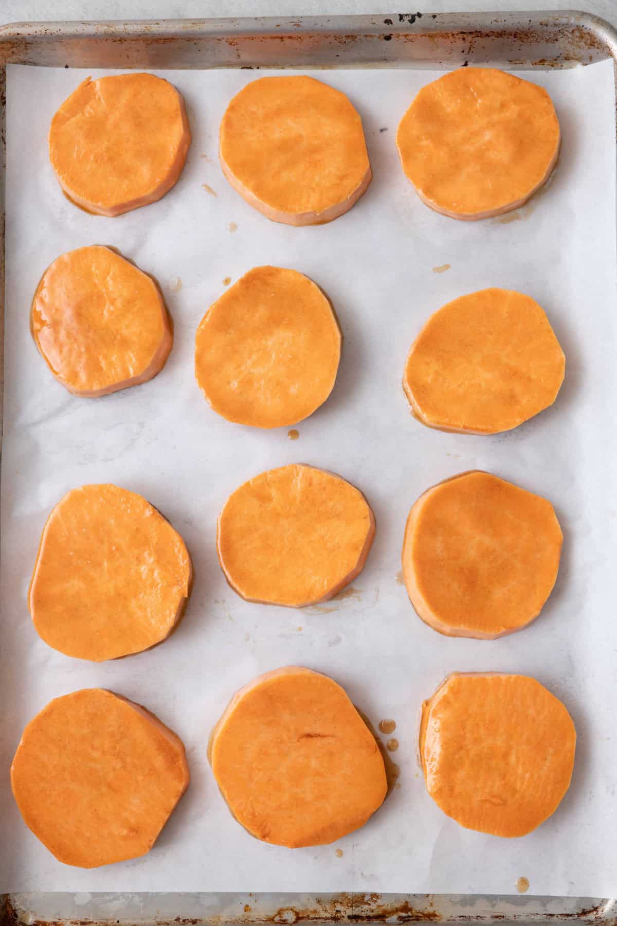 Sweet potatoes coated before baking.