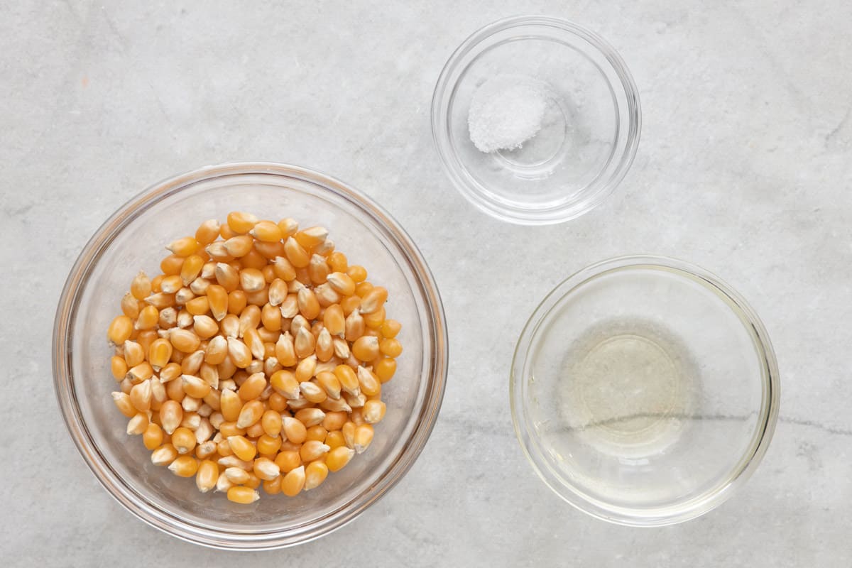 Ingredients for air fryer recipe: popcorn kernels, salt, and oil.