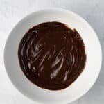Bowl of homemade ganache in white bowl.