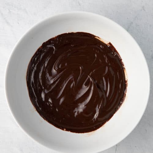 Bowl of homemade ganache in white bowl.