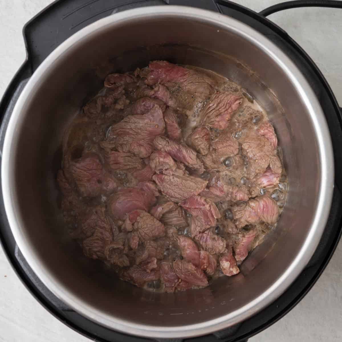 Beef inside Instant pot after cooked.