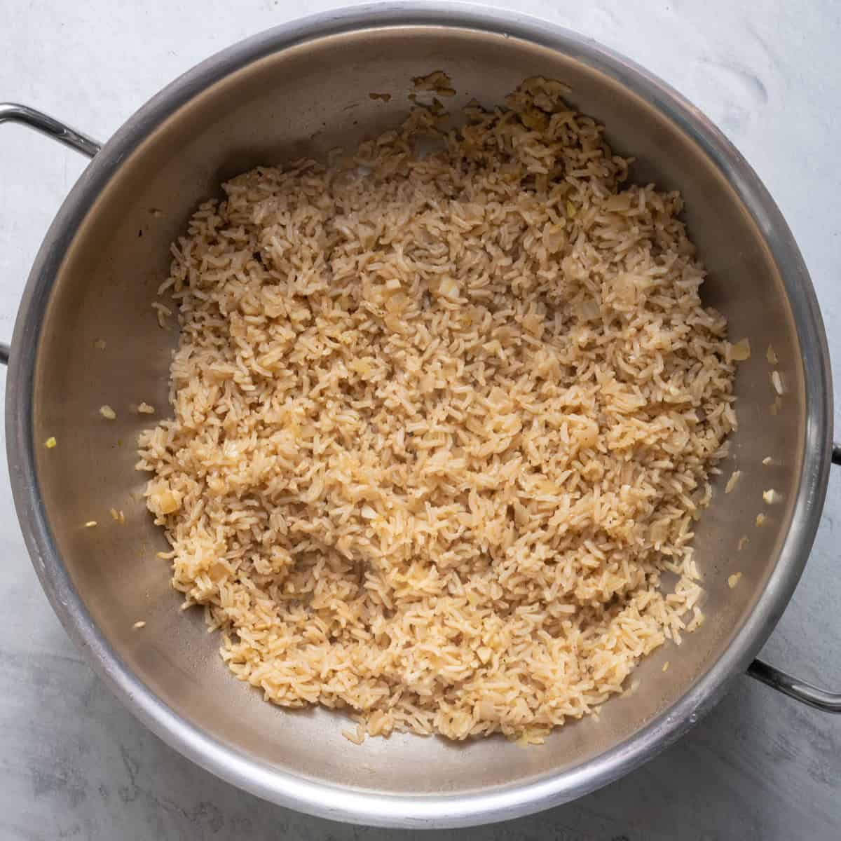 Water absorbed and rice cooked.