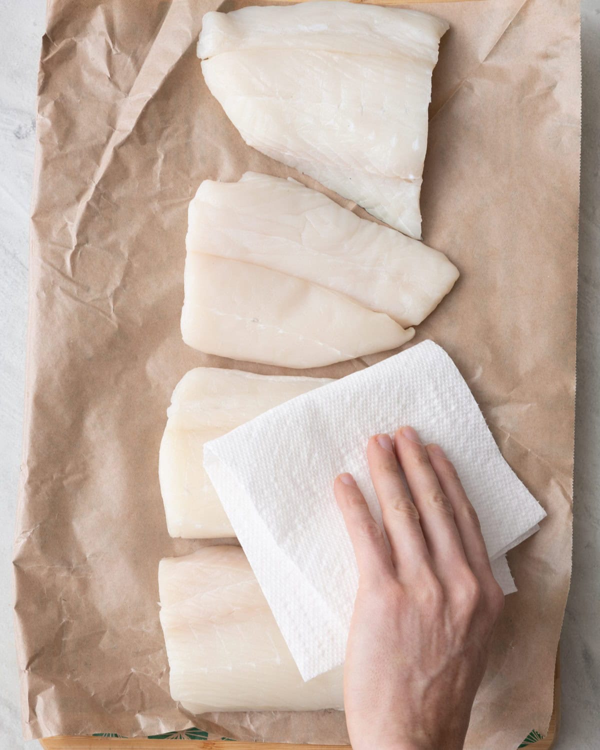 Pat halibut dry.