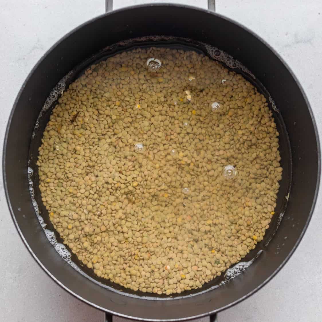 Water added to the pot of lentils.
