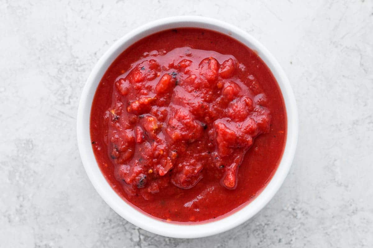 Canned crushed tomatoes in a bowl.