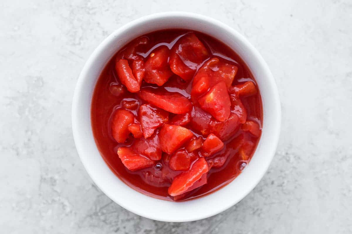Canned diced tomatoes in a bowl.