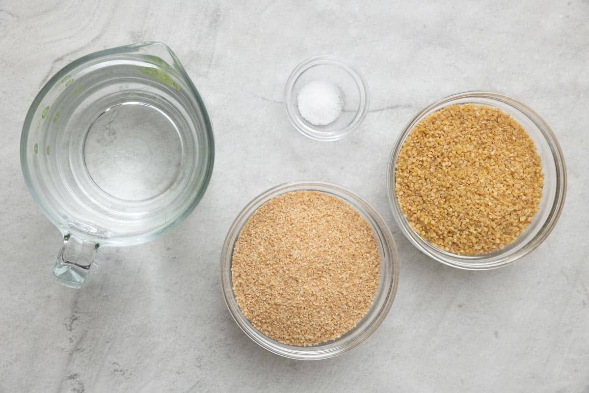 Ingredients for recipe: water, salt, and 2 small bowls with different sized grains.