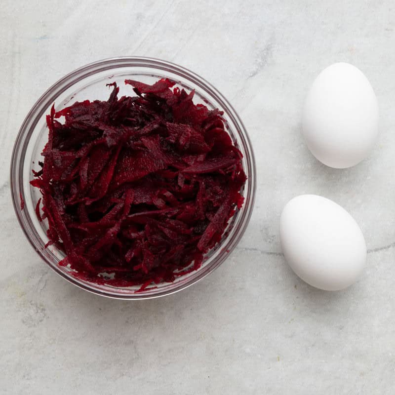 Ingredients to make pink dyed eggs.