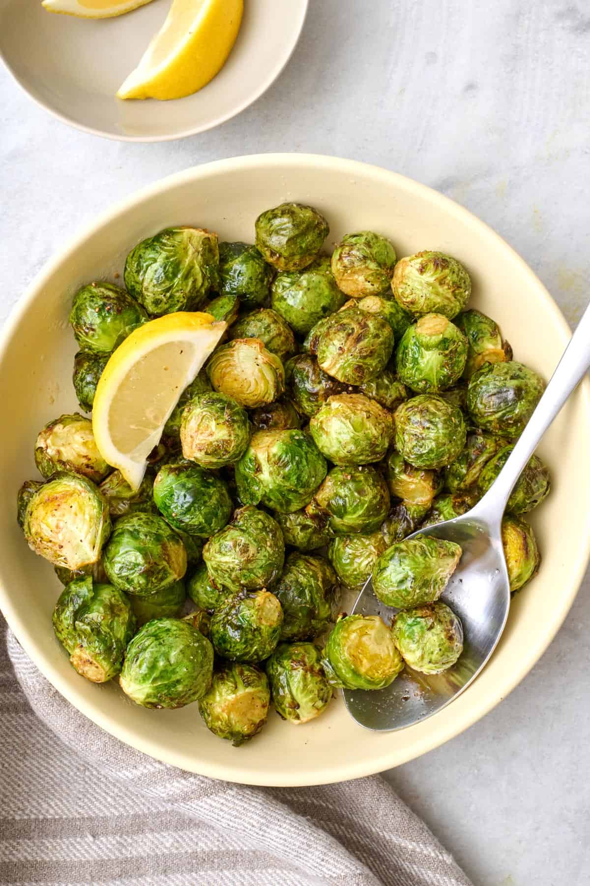 Air fryer brussel sprouts in a bowl.
