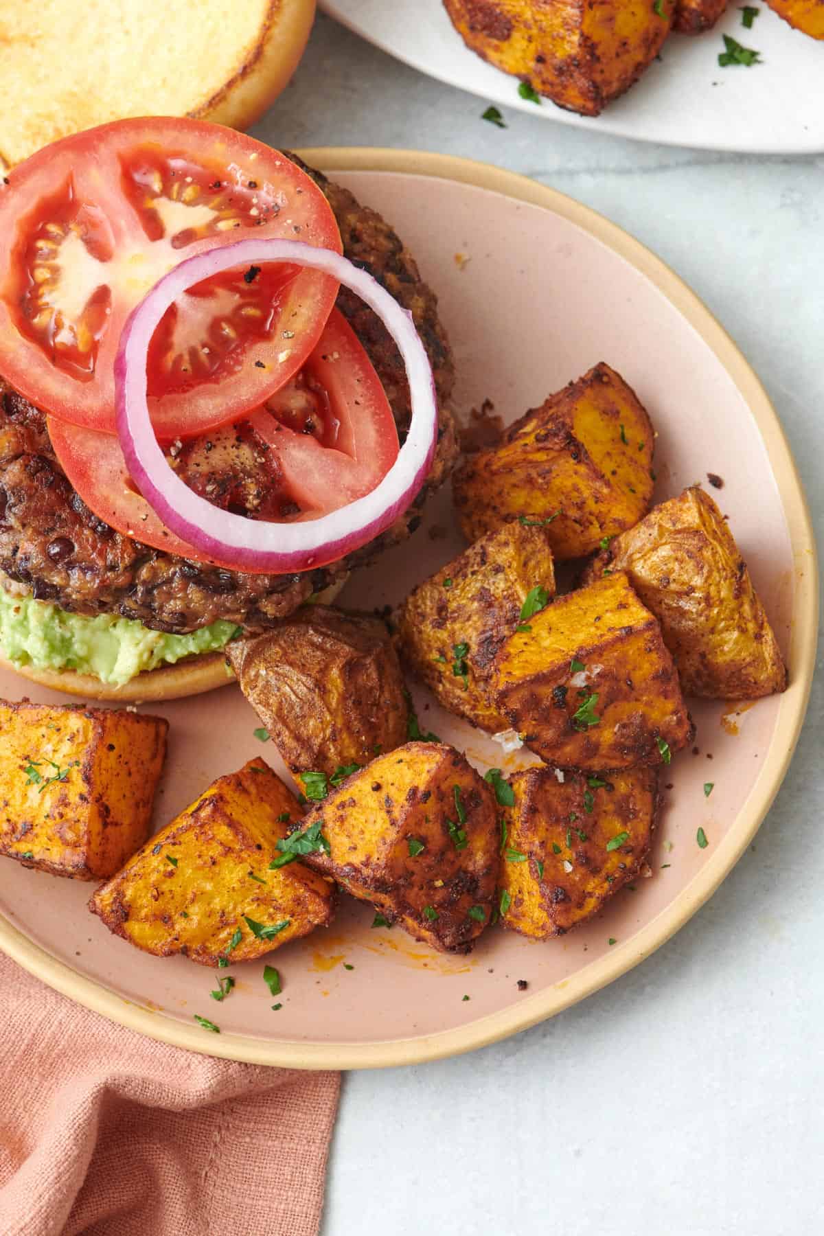 Close up shot of air fryer potatoes that are crispy and golden after being cooked.