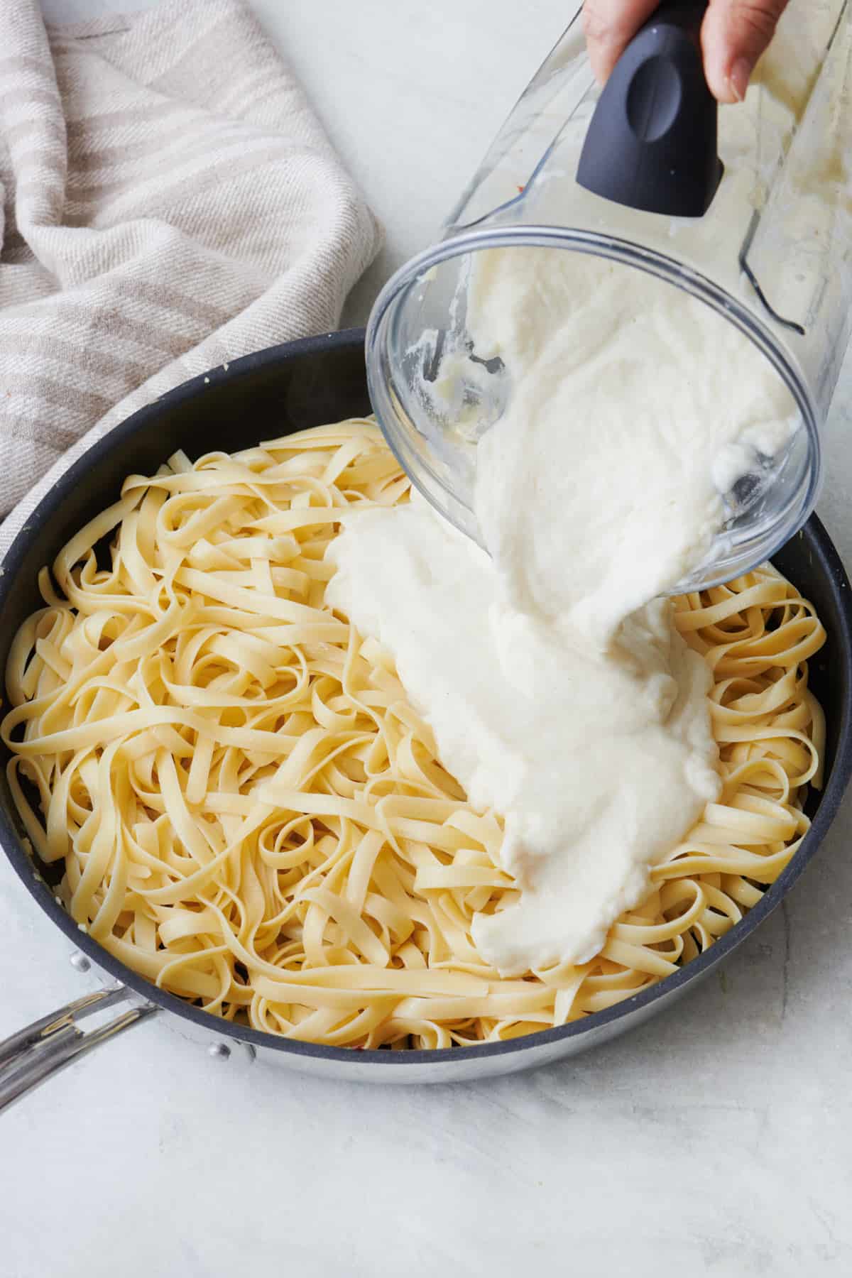 Fettuccine alfredo with Brandless blender in background