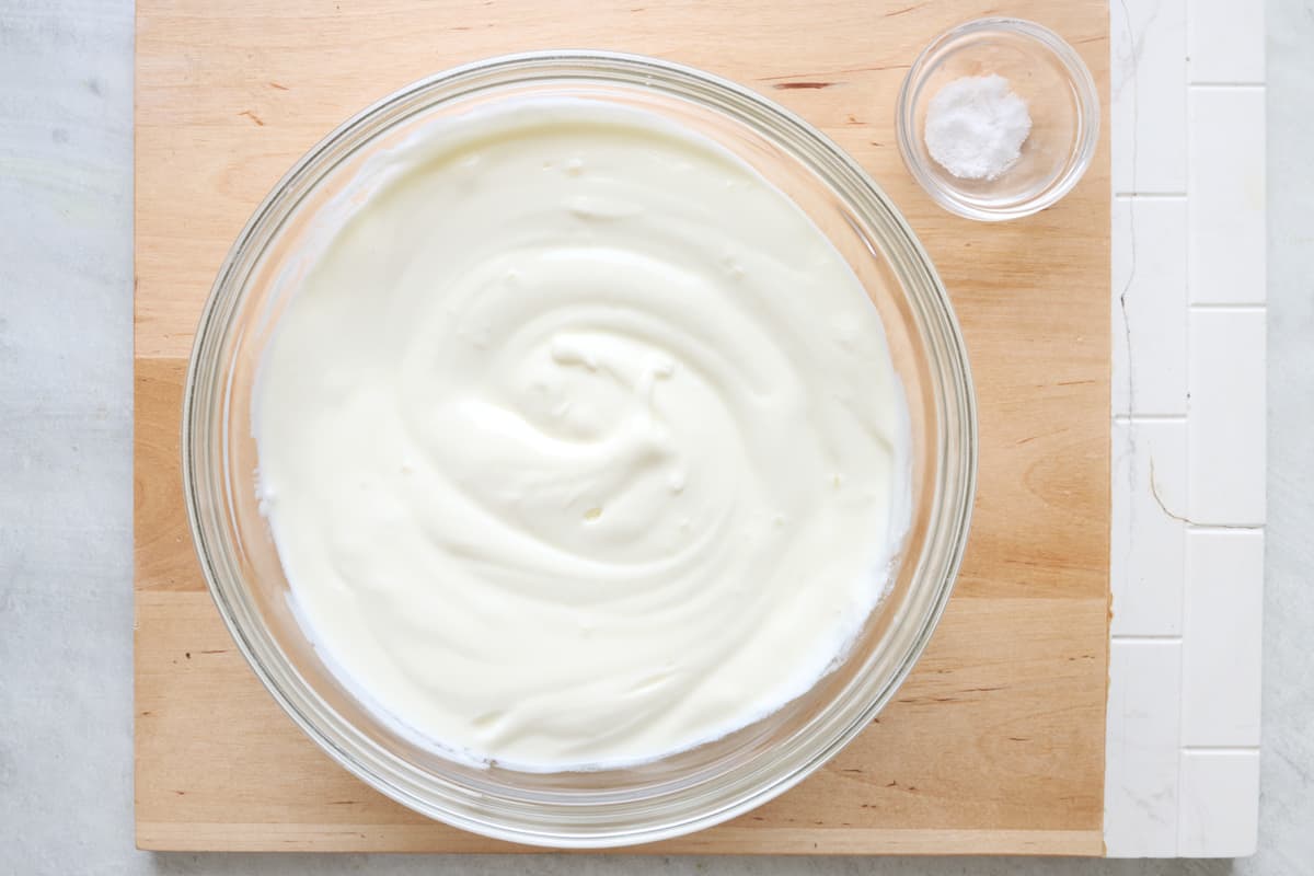 The labneh in a blue bowl once it has been drained.