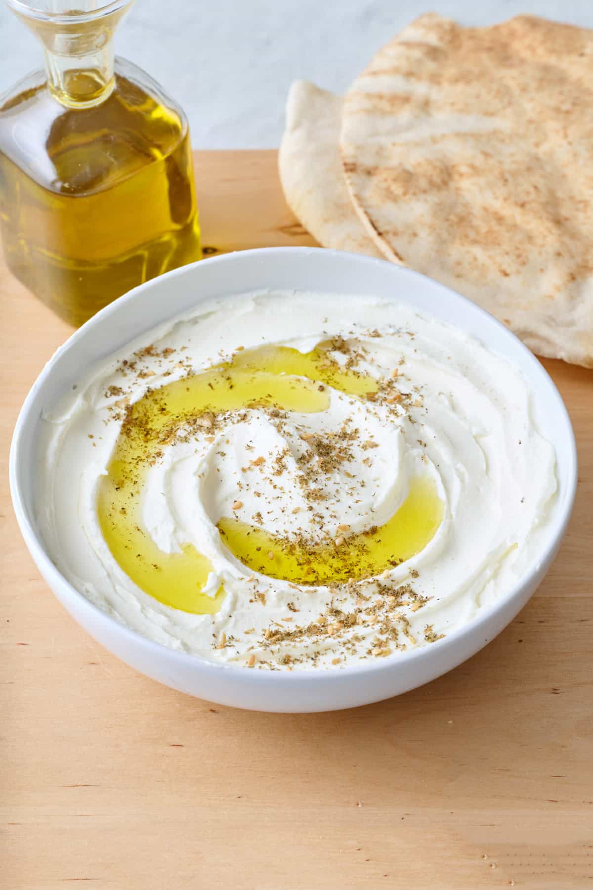 Swirled lebneh in a white bowl