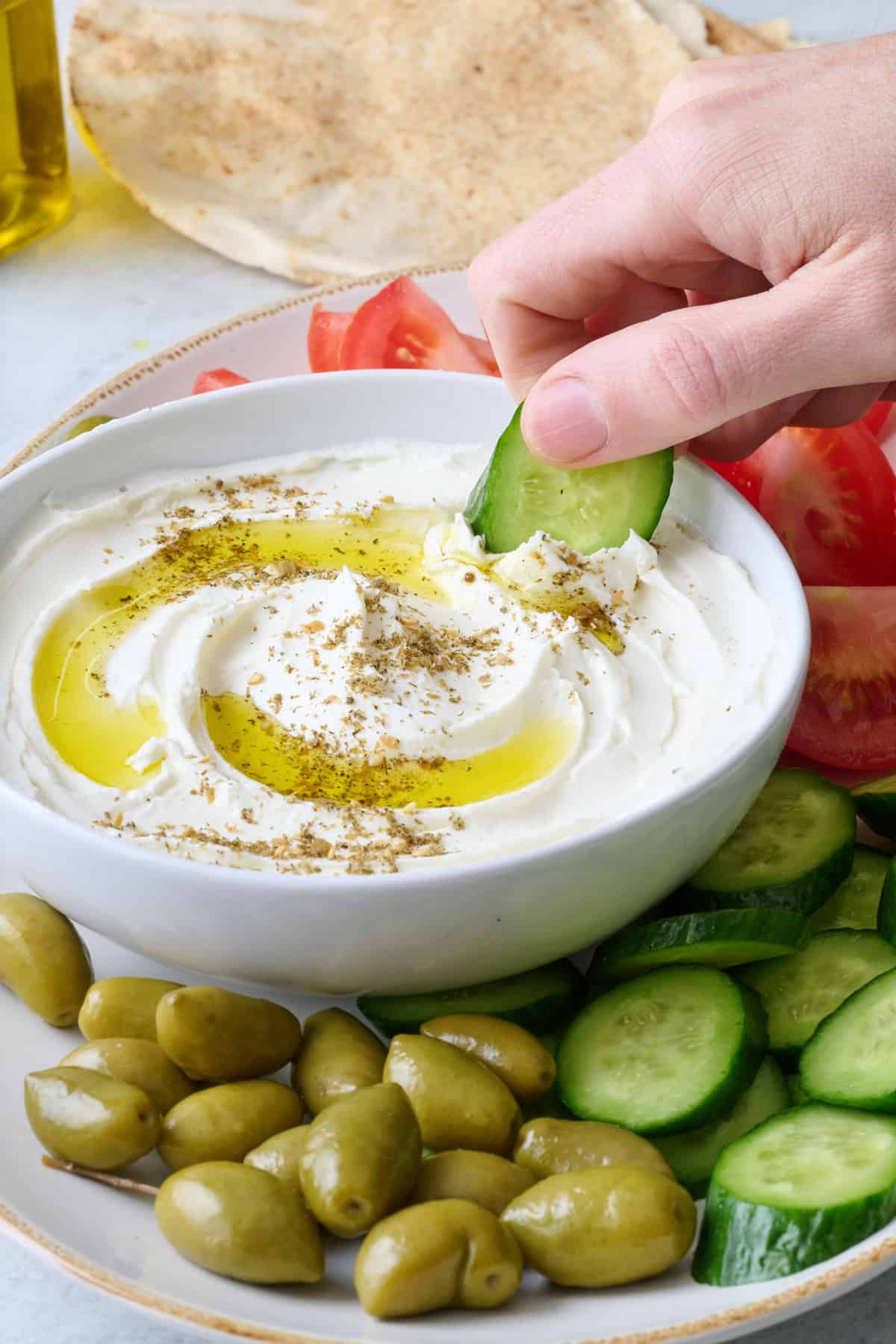 Slices of fresh vegetables and dip with olive oil