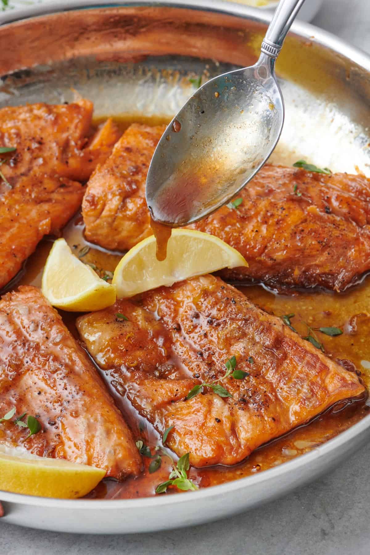 Flipping the salmon over to sear the skin side