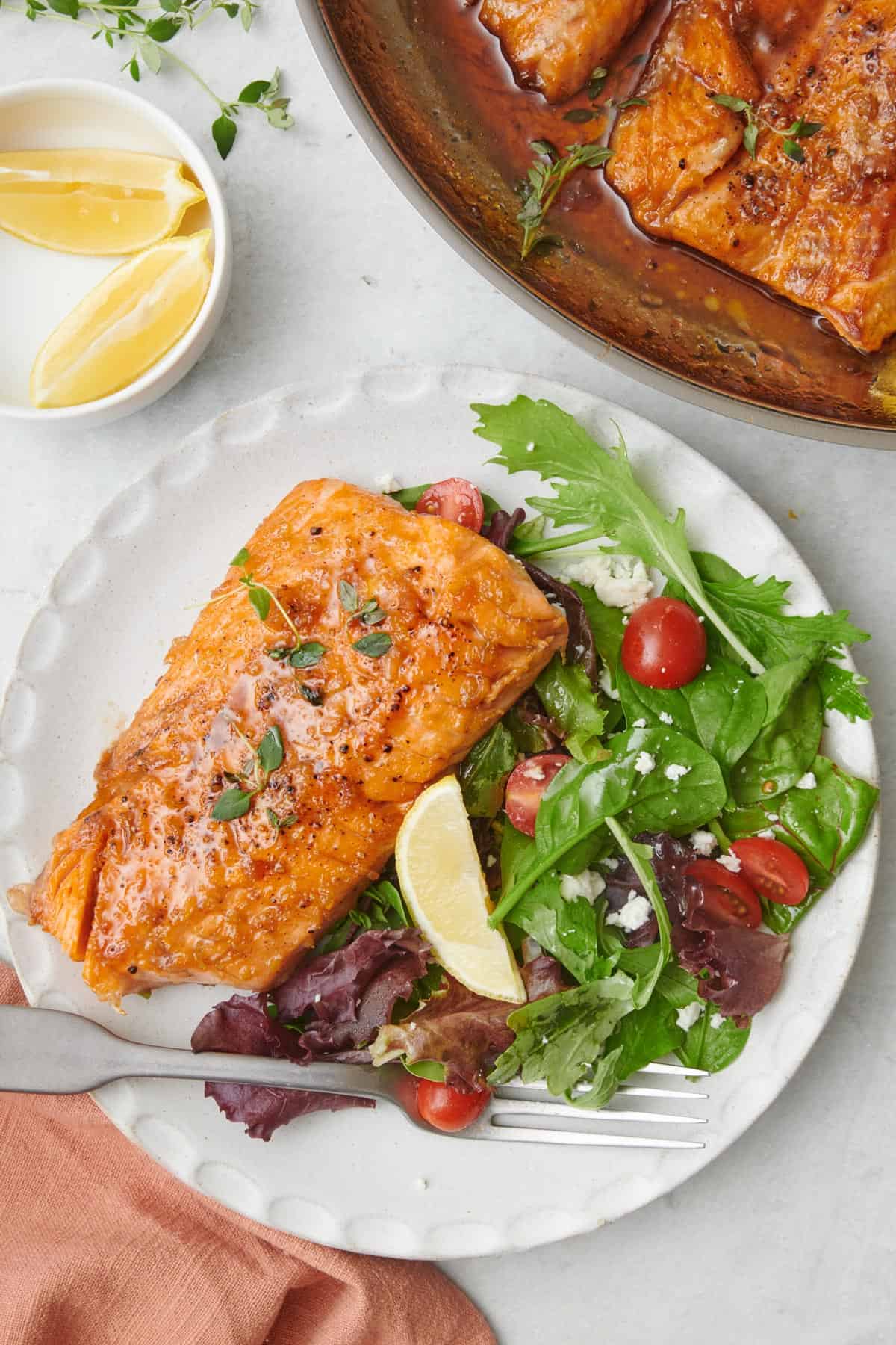 Honey lemon salmon on a bed of greens