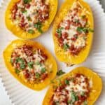 Collage of two images showing spaghetti squash halved before and after removing seeds