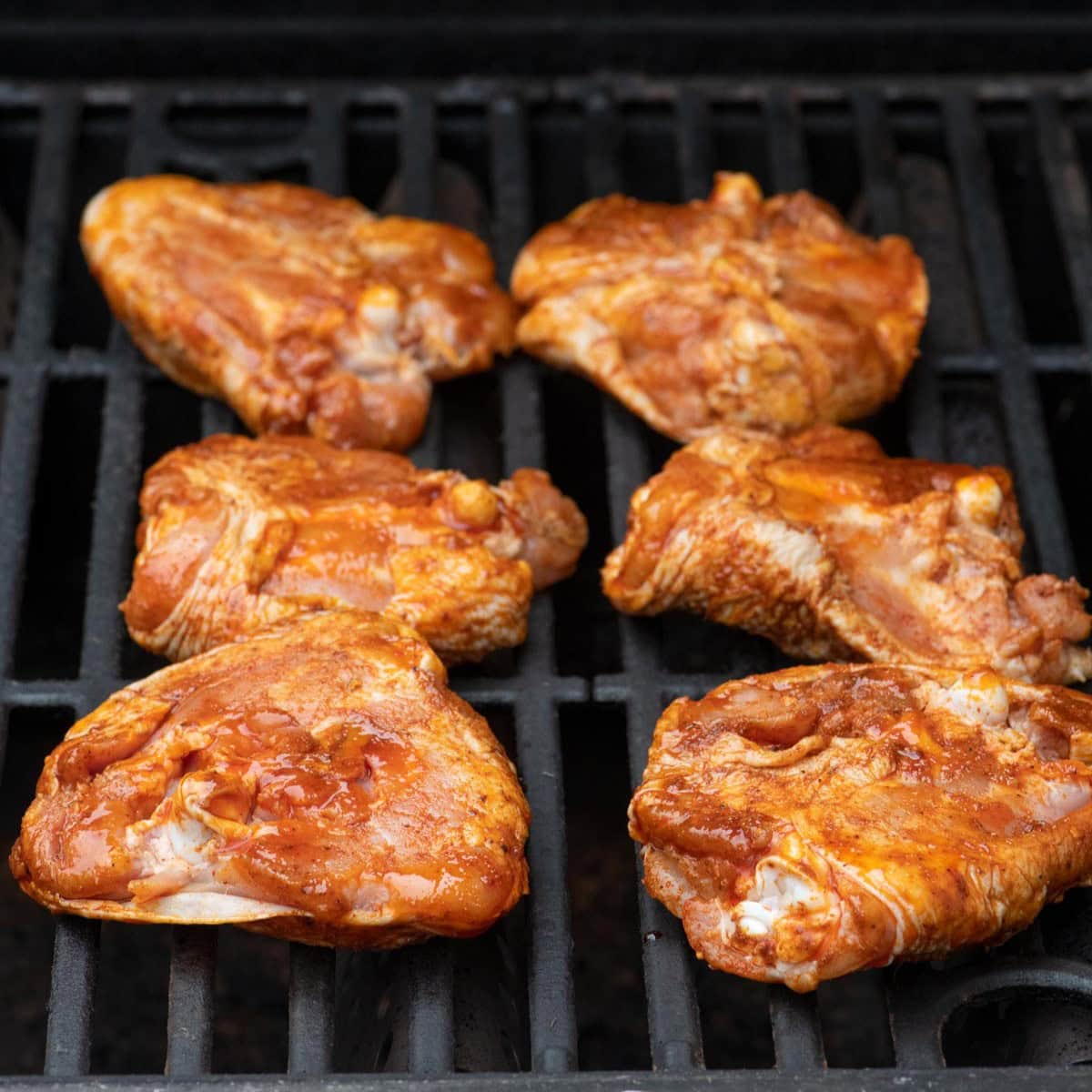 Chicken on the grill, skin side down.