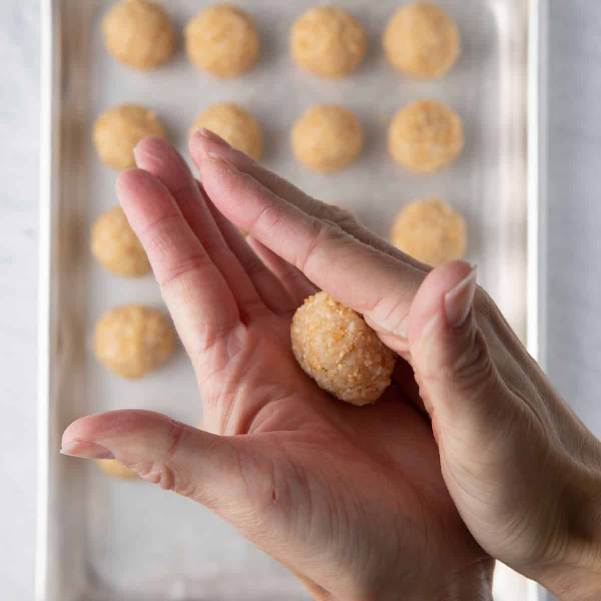 Rolling coconut ball.