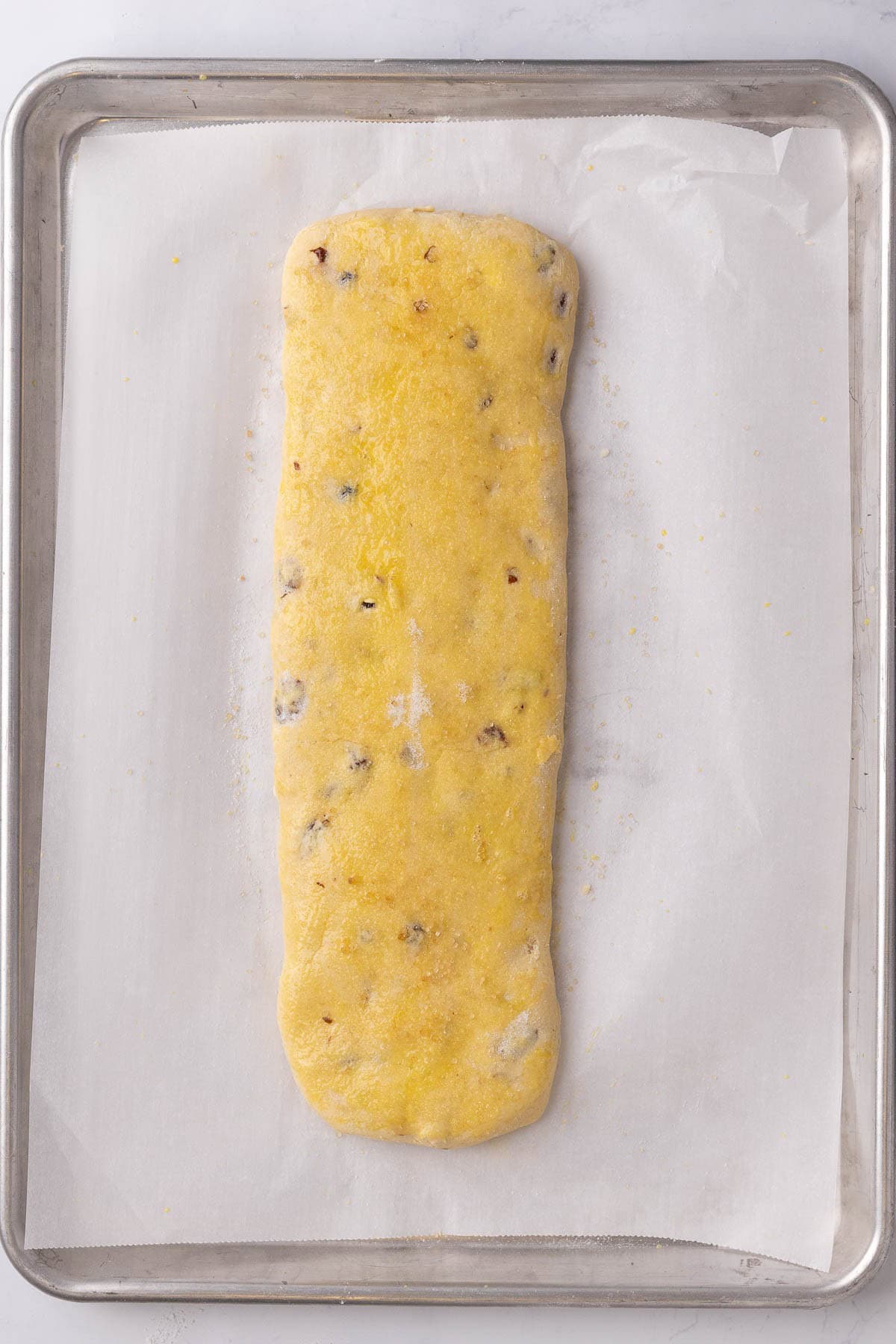Biscotti before baking egg wash on top and sugar sprinkled on top.
