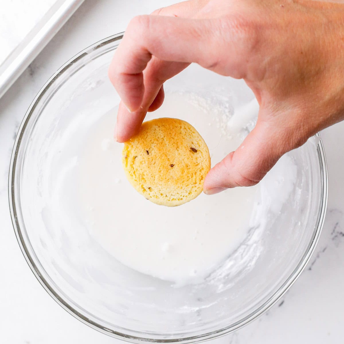 Cookie after dipping into the icing and pulling it back up.