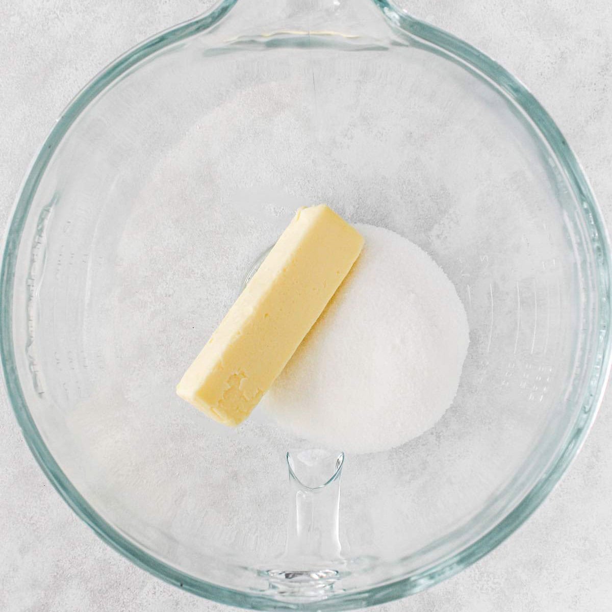 Butter and sugar in a stand mixer before creaming together.
