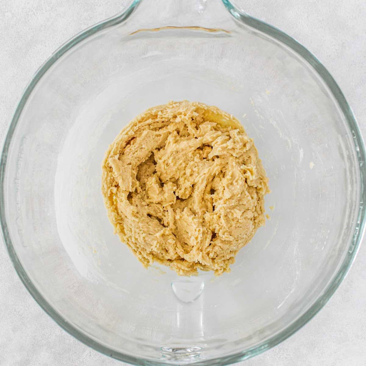 After folding the flour mixture into the cookie dough with no more steaks remaining.