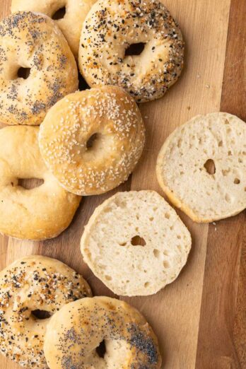 Homemade bagels on a cutting board.