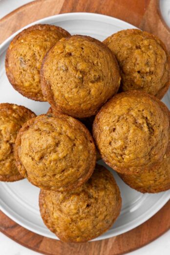 Pumpkin banana muffins on a plate.