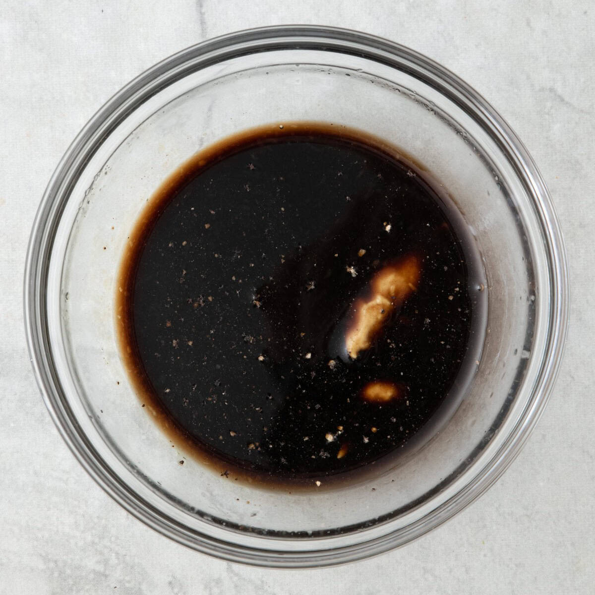Ingredients for the dressing in a bowl before mixing.