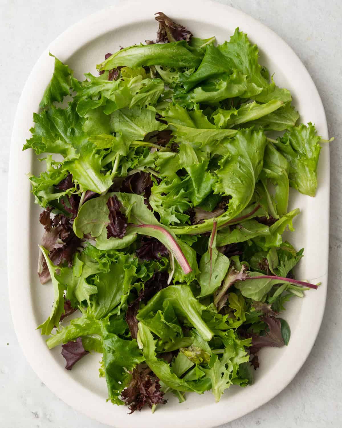Lettuce laid on a plate.