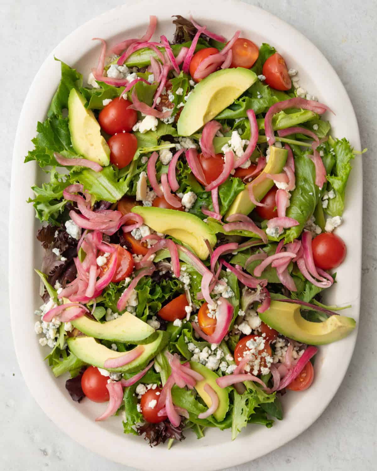 Salad toppings added to the lettuce, before adding the steak.