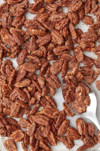 Candied pecans on baking sheet.