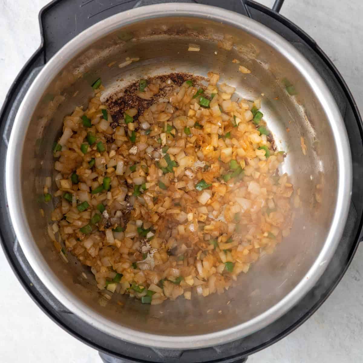 Thighs removed from IP. Onions, jalapenos, and garlic added shown after cooked.