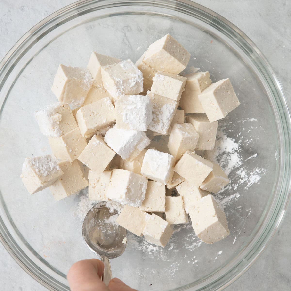 Stirring tofu with cornstarch.