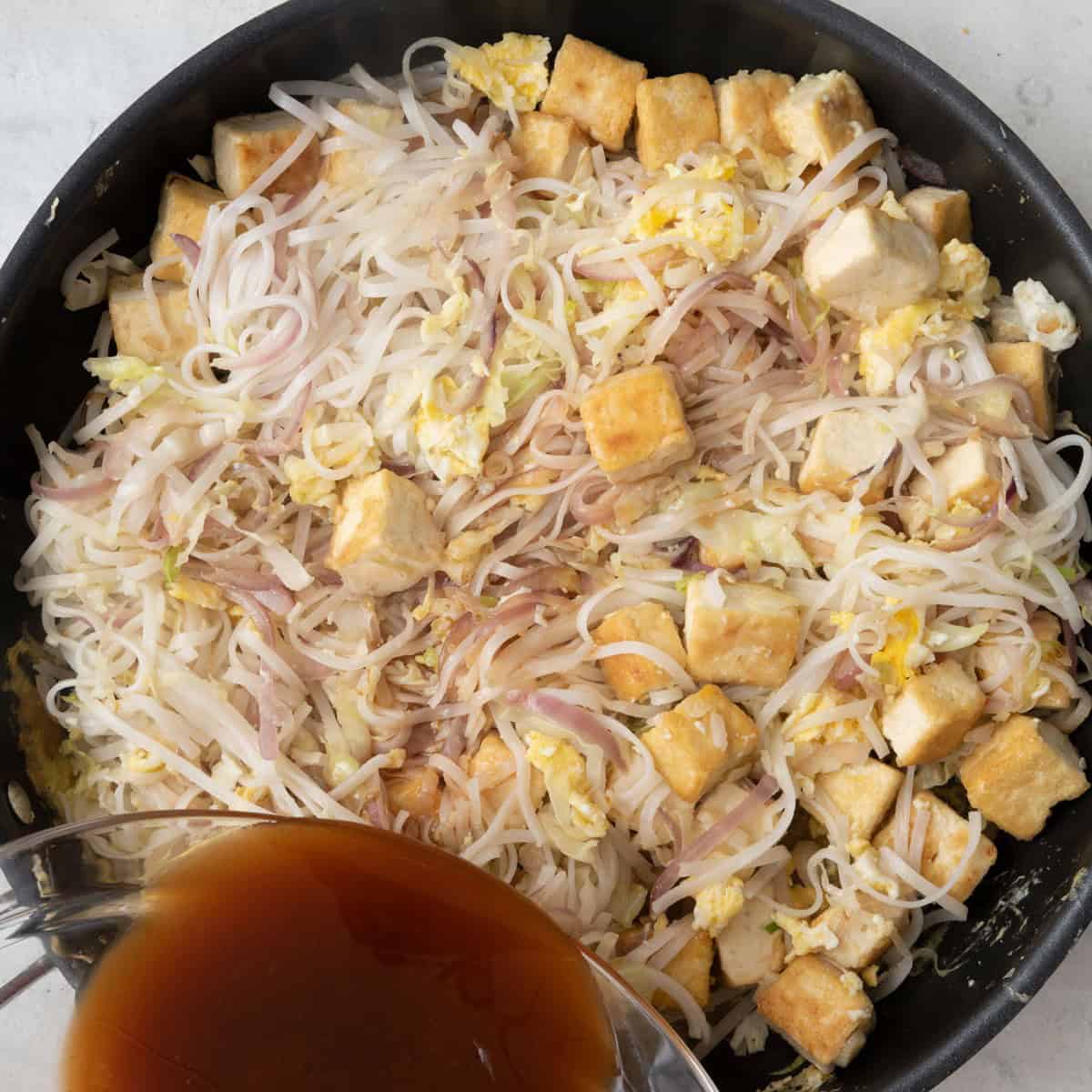 After eggs scrambled, adding sauce.
