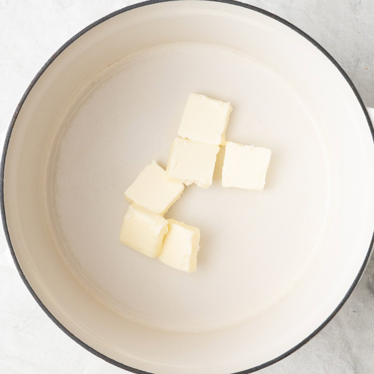 Butter in a pot before melting.