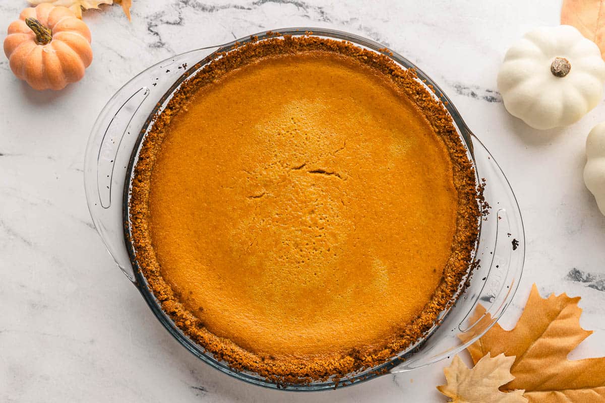 Homemade pumpkin pie with a graham cracker crust.