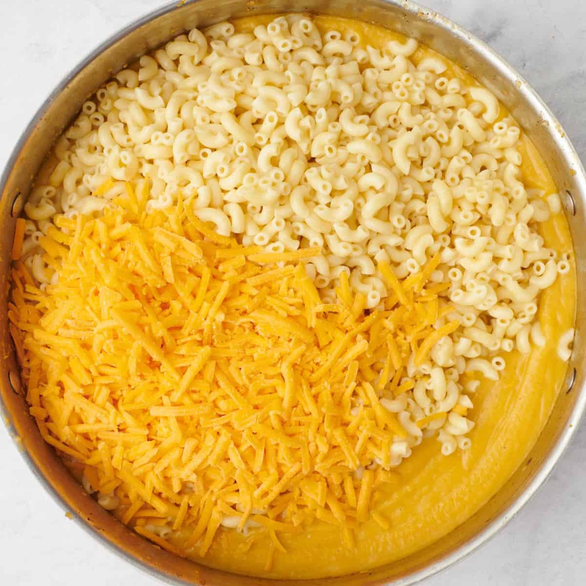 After sauce is smooth with cooked pasta and shredded cheese added.