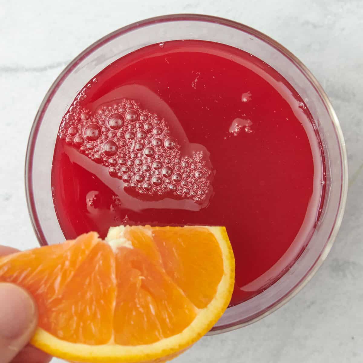 Adding orange slices.