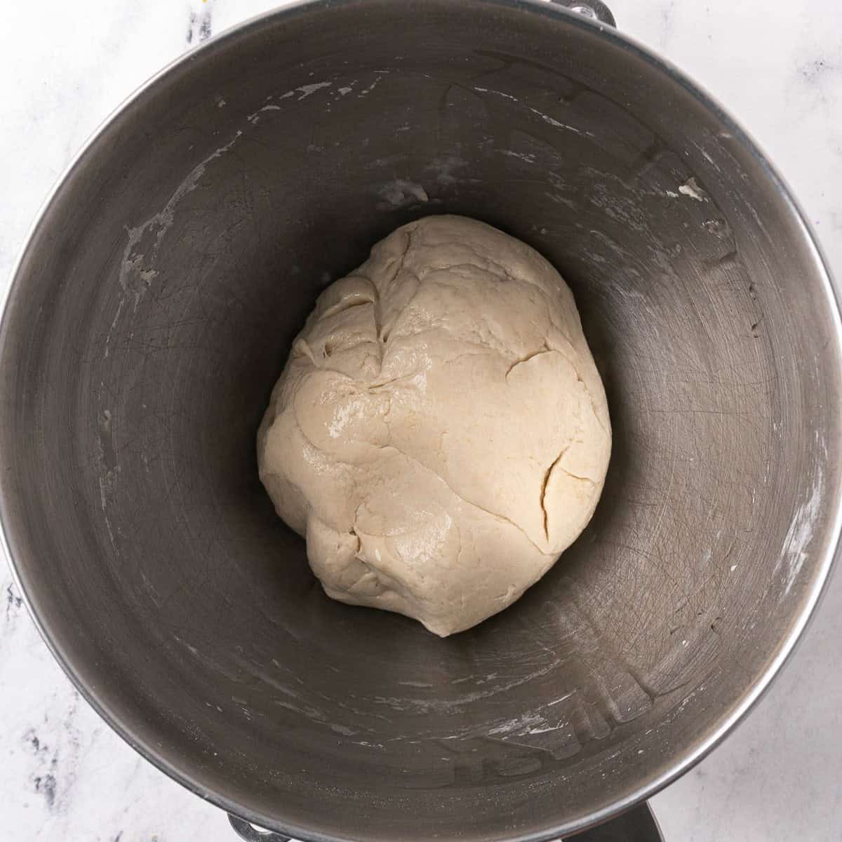 Dough ball lightly oiled in the same stand mixer bowl.
